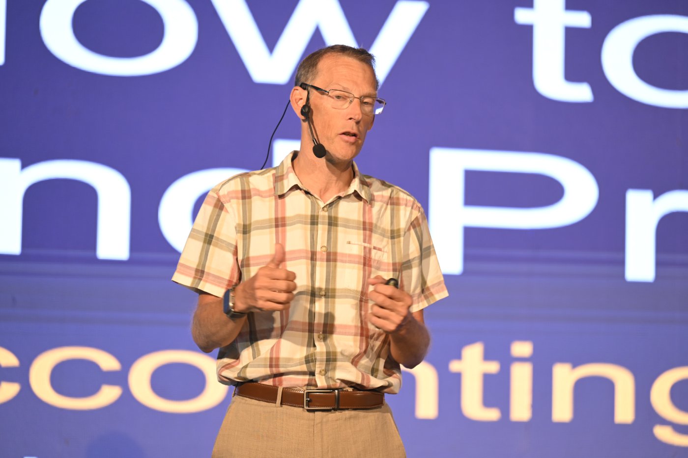 Mark presenting live on stage